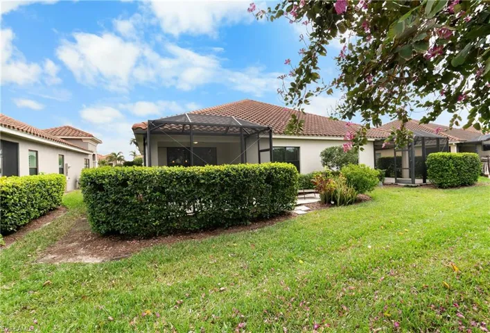View of yard with privacy hedges