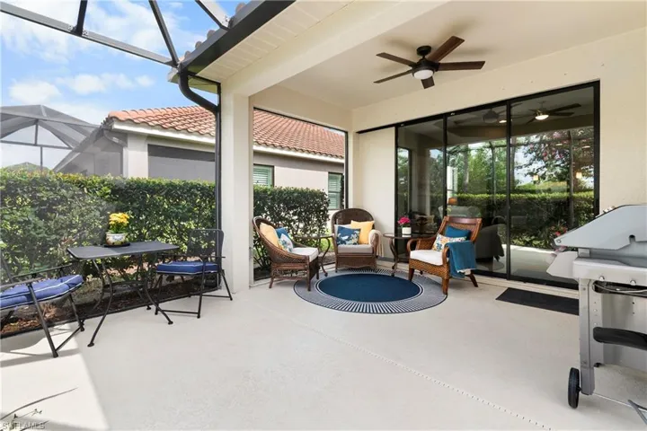 View of lanai, grilling area, and a ceiling fan