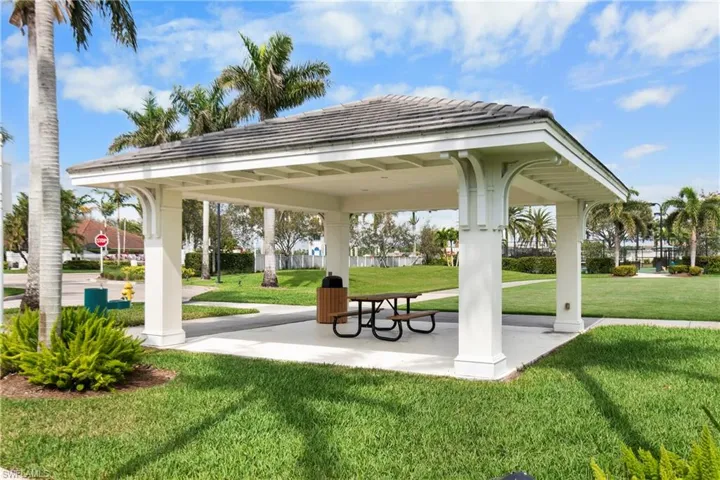 View of property's community featuring a lawn and a gazebo