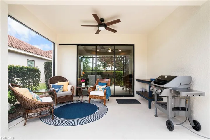 View of patio with a ceiling fan and grilling area