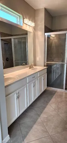 Walk in Shower, double sinks, toilet enclosed, walk in closet