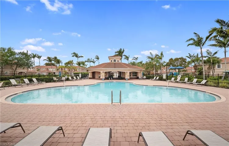 Community pool with a patio