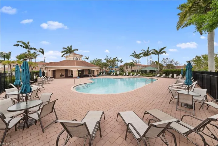 Community pool with a patio area