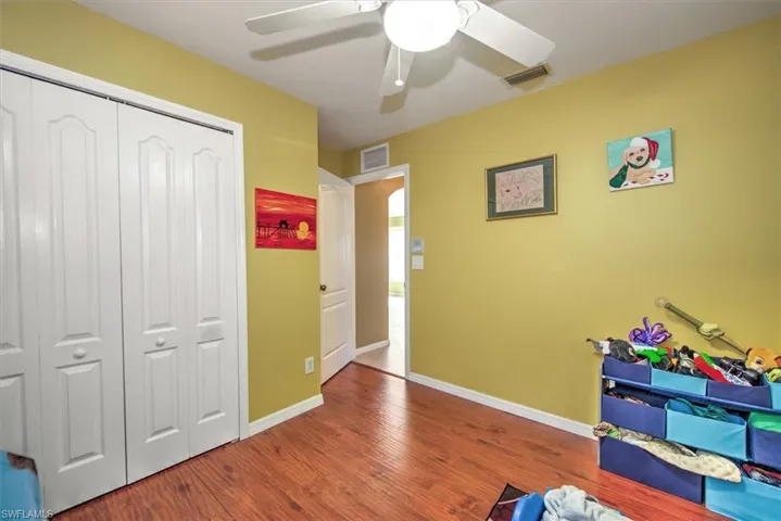 Rec room with ceiling fan and hardwood / wood-style flooring