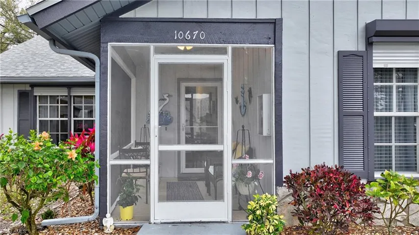 Property entrance featuring board and batten siding