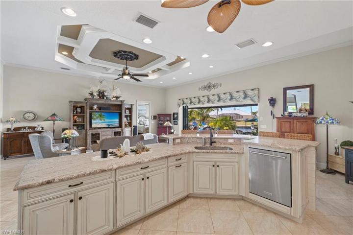 When washing dishes becomes fun!  This home is designed to both funcational - open concept and open to the outdoor iving space!