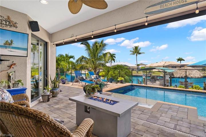 WOWZA!!  Where to start.....a covered and shaded lanai with the MOST incredible view - having a bad day?  Take a deep breath and kick back and watch the sunset from this prime location - every day is different and a pure work of art - Hurricane kavalar screens can enclose the patio for privacy - storm coming?  No problem - just bring the furniture behind the screens!