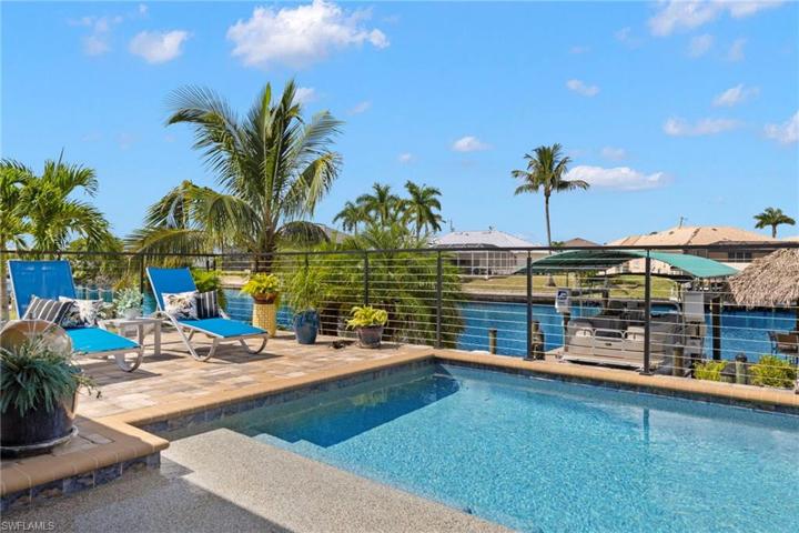 Large lounging area for sunning both in and out of the pool, seating and a sunken table - life is good!