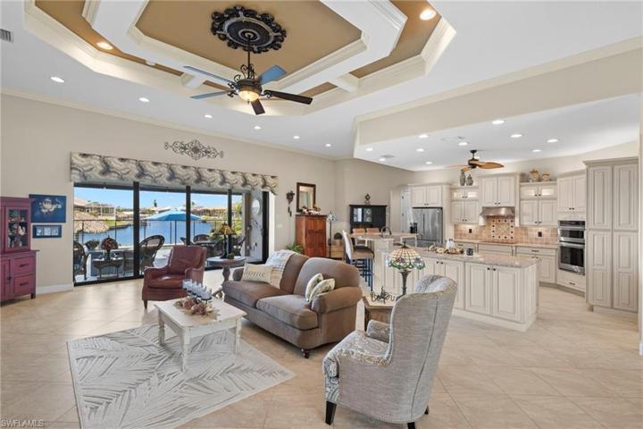 Custom window treatments and designer ceiling details - finish carpentry, lighting and medallion are a work of art!