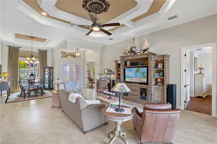 Beautiful double door entry with transom window above and a large dining room window let in an abundance of natural light throughout the main living areas.
