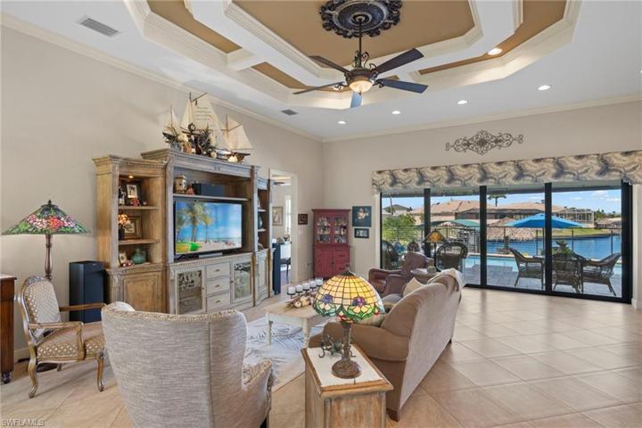 Great room will hold all your large furniture combinations and has extra outlets in the floor, diagonally laid tile and an open concept to dining, den and kitchen!
