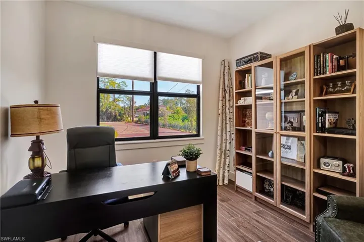 Office with hardwood / wood-style flooring
