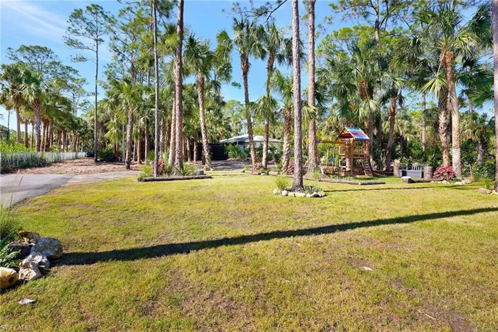 View of yard featuring a playground