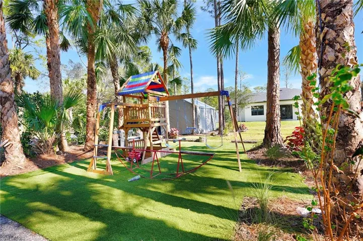 View of playground featuring a yard