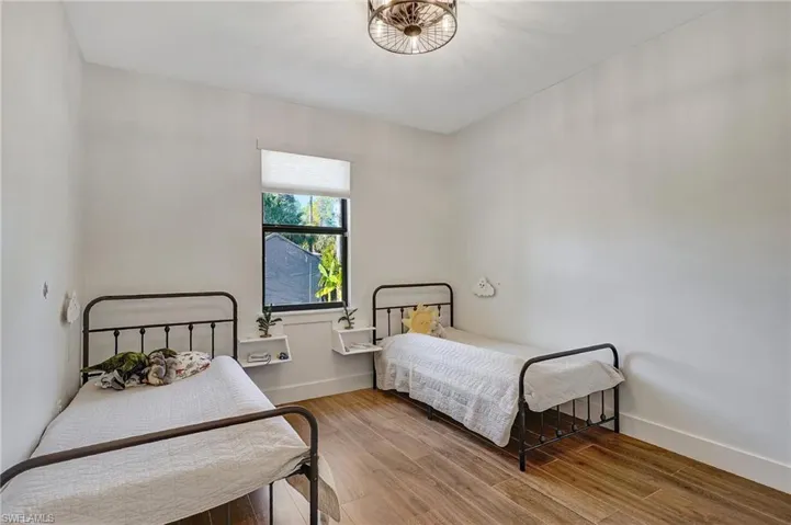 Bedroom with wood-type flooring