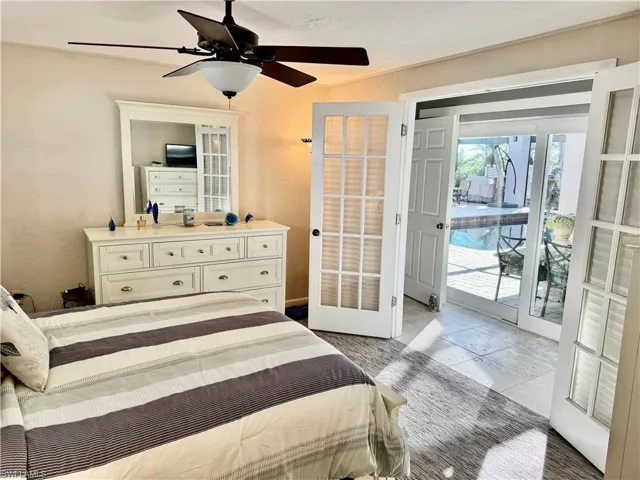 Bedroom featuring ceiling fan, access to exterior, and french doors