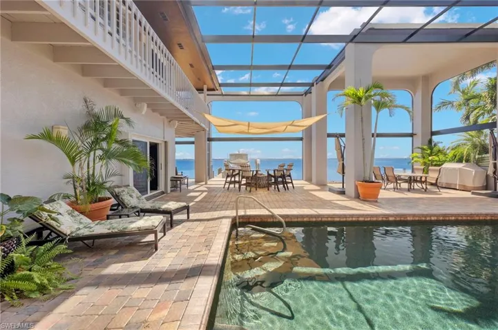 View of swimming pool featuring a water view