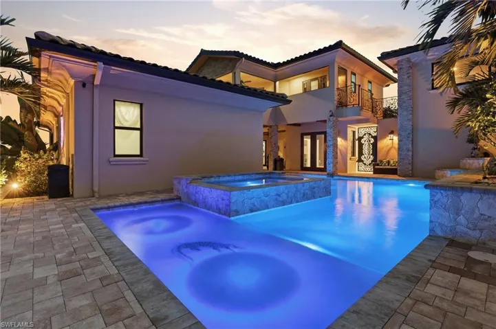 Lighted pool with waterfall feature