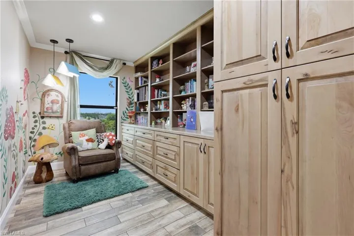 Custom built-in shelving and cabinetry with ample storage