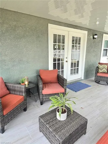 Wood like tile deck featuring french doors and bathroom access to master bedroom