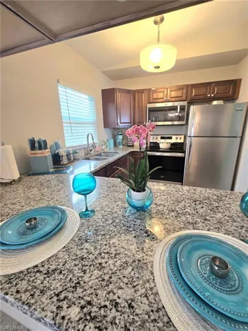 Fully stocked kitchen with dishware, stemware and cookware