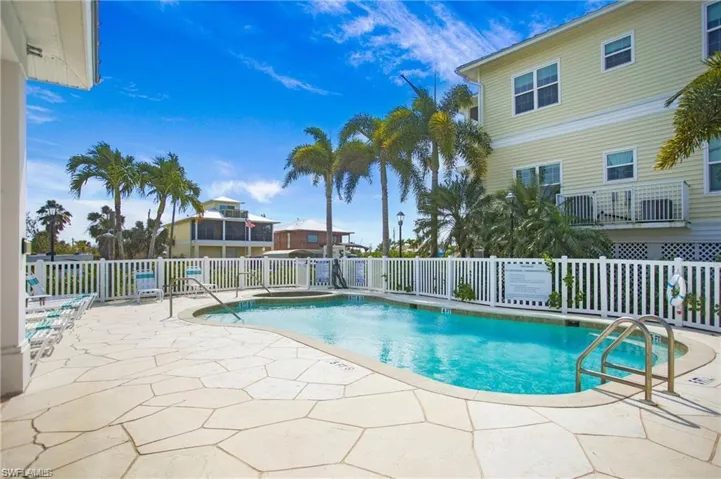 Community pool featuring a patio