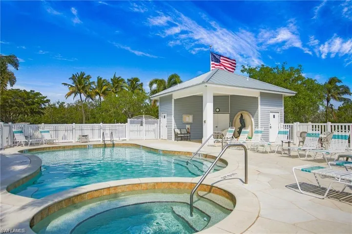 Community pool with a patio and a community hot tub