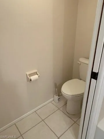 Bathroom featuring baseboards and tile patterned flooring