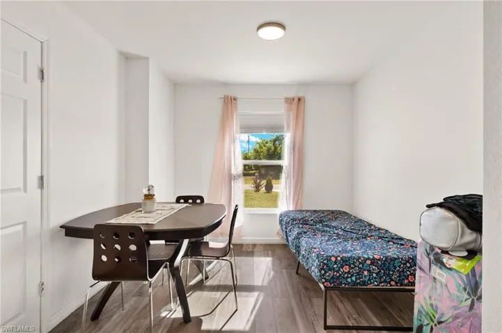 Bedroom with wood-type flooring