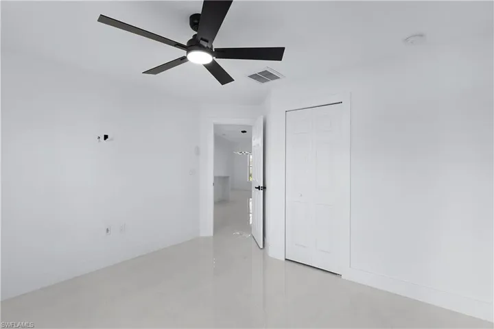 Spare room featuring ceiling fan