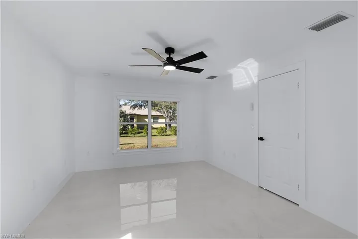 Unfurnished room with ceiling fan