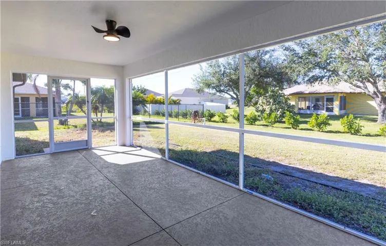 Unfurnished sunroom with ceiling fan and a healthy amount of sunlight