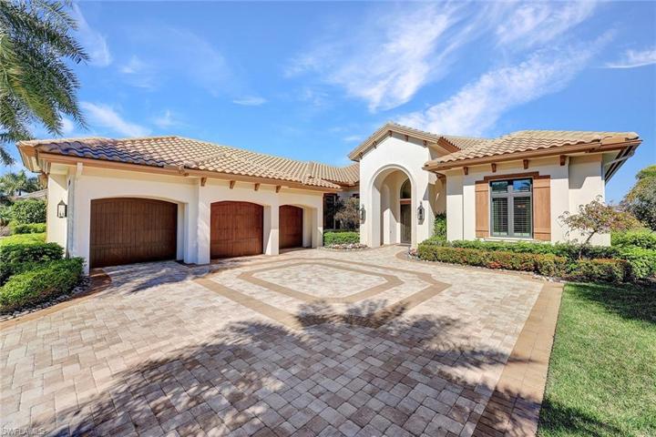 Located on the best street in Talis Park, with water providing privacy from the cart paths