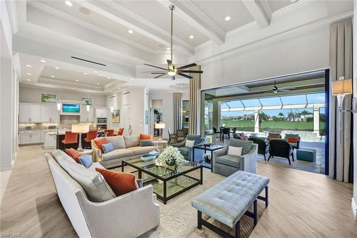 Living area with 16’ Ceilings and built in surround sound opens to the pool and view with pocketing Impact doors