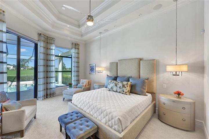 The spacious King primary bedroom suite offers built in surround sound and his and hers closets