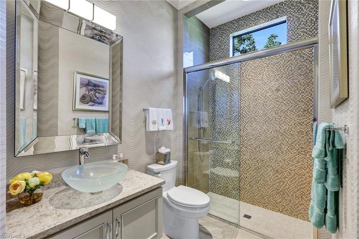 The 4th full bath is adjacent to the office and a door leading to the pool
