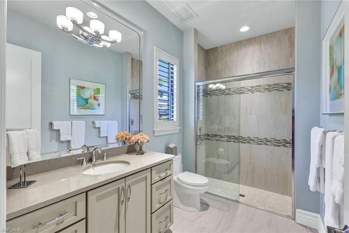 Private guest ensuite bath, and not pictured is a walk-in closet with custom shelving