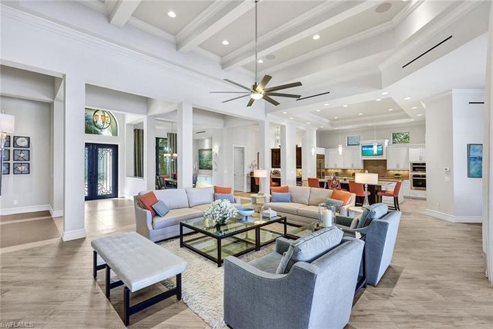 Stunning double door entry leads to an open living space encompassing 5 gathering areas