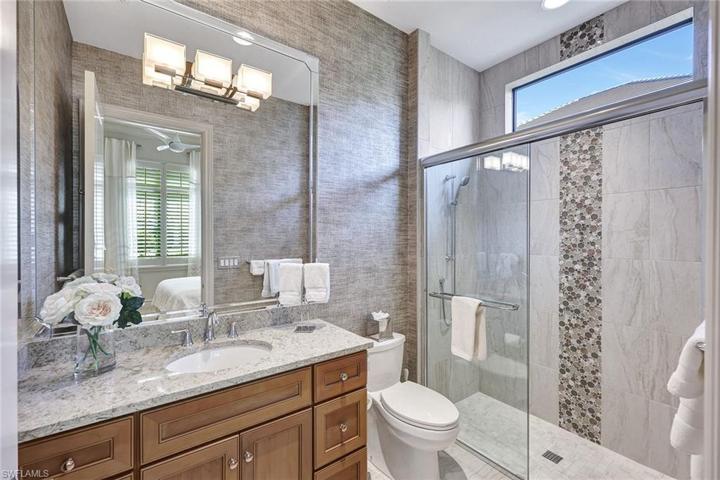 Private king guest ensuite bath and not pictured is a walk-in closet with custom shelving
