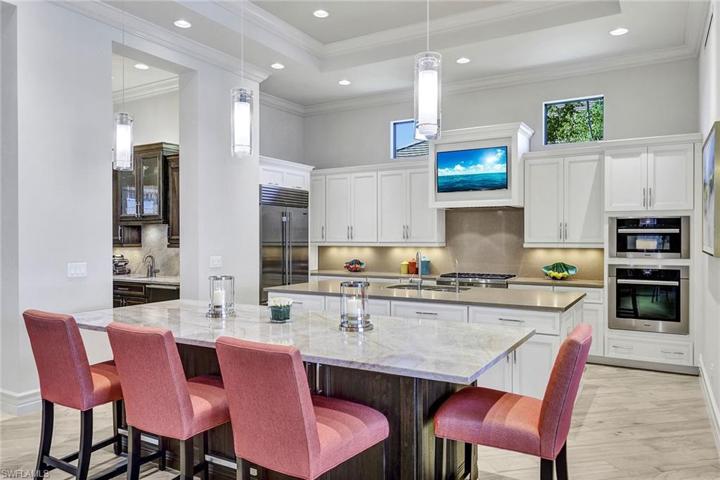 The seating Island is adjacent to the wet bar and kitchen island for easy access to everything you need