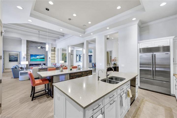 Storage on both sides of both islands and pull out shelves behind every cabinet door