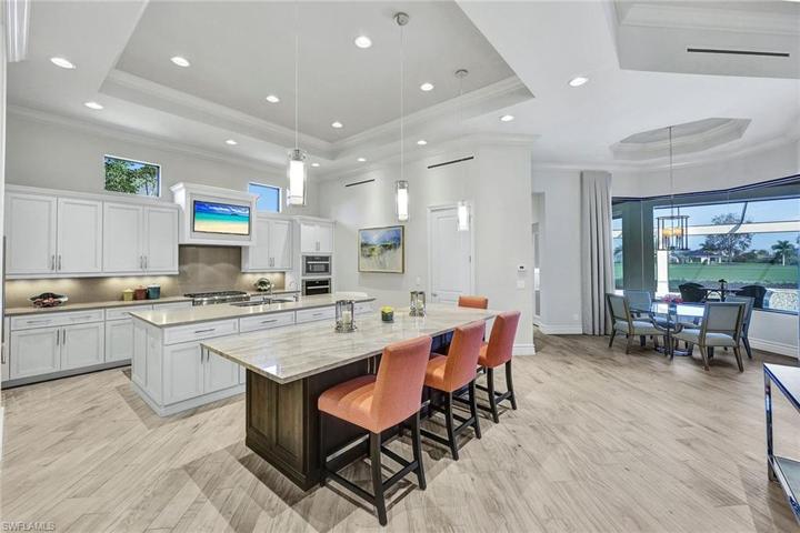 Chefs Kitchen with TV & two Islands with storage on both sides and pull-out shelves behind every door