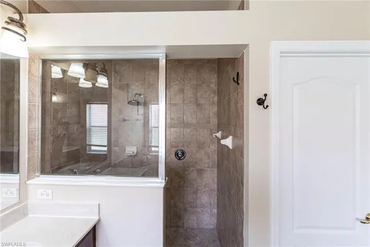 Full bathroom featuring vanity and walk in shower