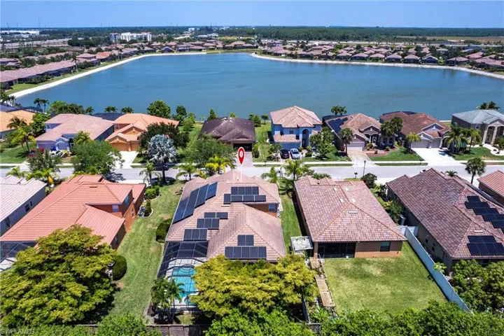 Birds eye view of property featuring a residential view and a water view