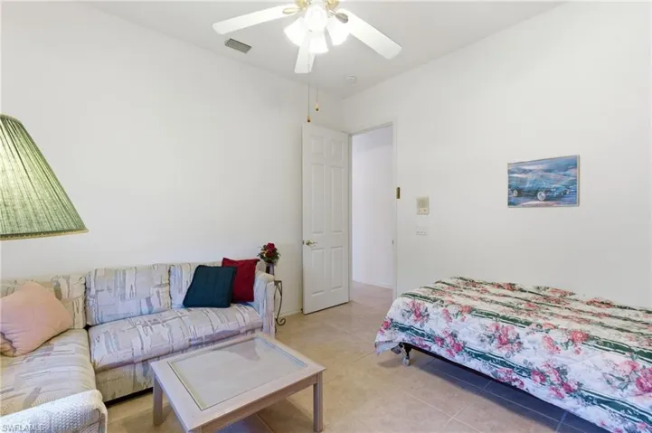 Bedroom featuring ceiling fan and light tile patterned flooring