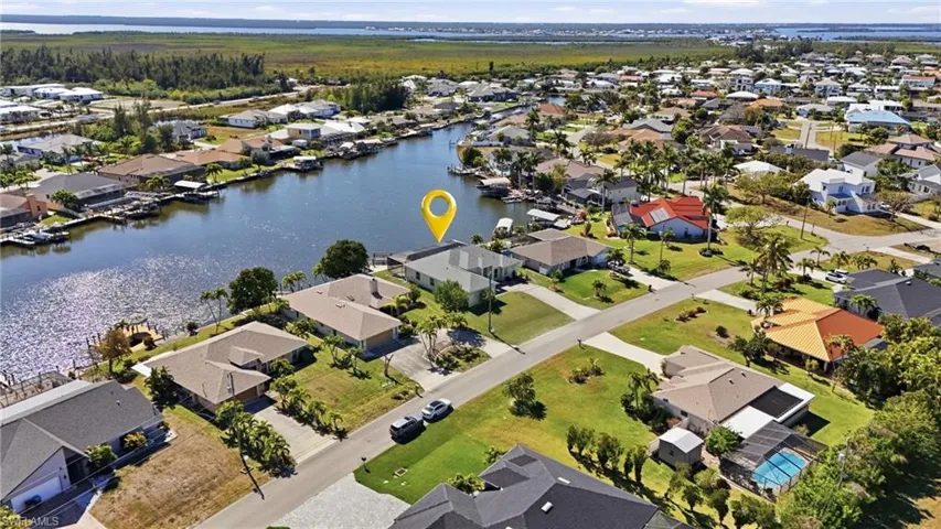 Aerial view of residential area with a large body of water