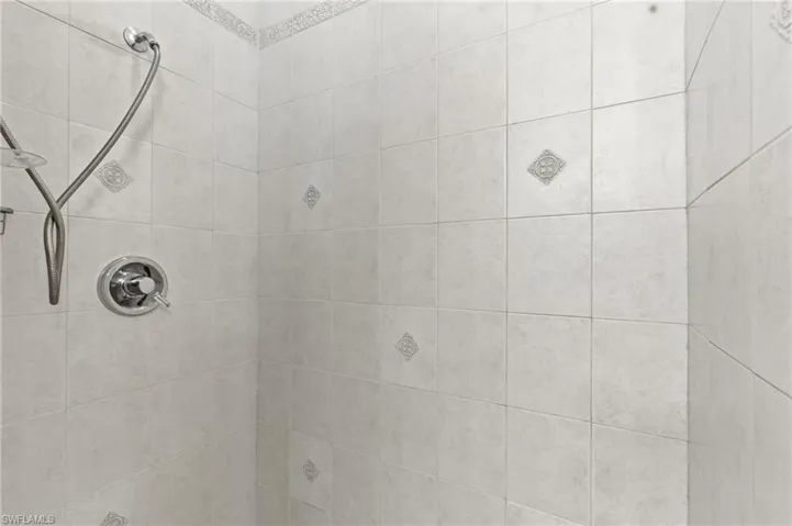 Bathroom view of a tile shower