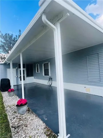 Covered entry and outdoor space for enjoying Florida sunshine.