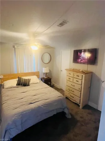Comfortable bedroom with natural light and relaxing atmosphere.