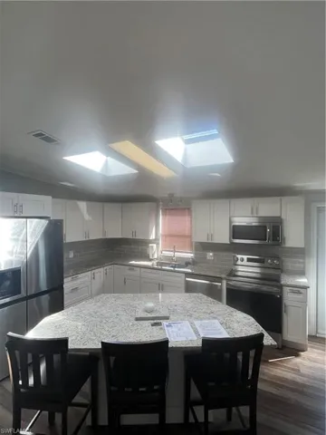 Spacious kitchen with ample counter space and room to gather.